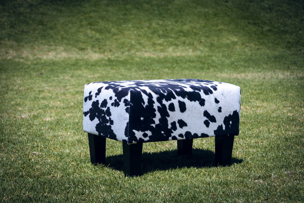 Spotty faux cow skin fabric footstool