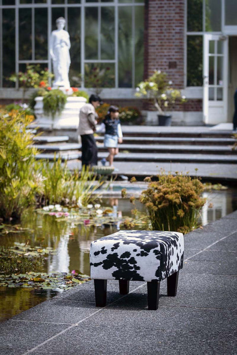 Spotty fake black & white cow skin fabric footstool