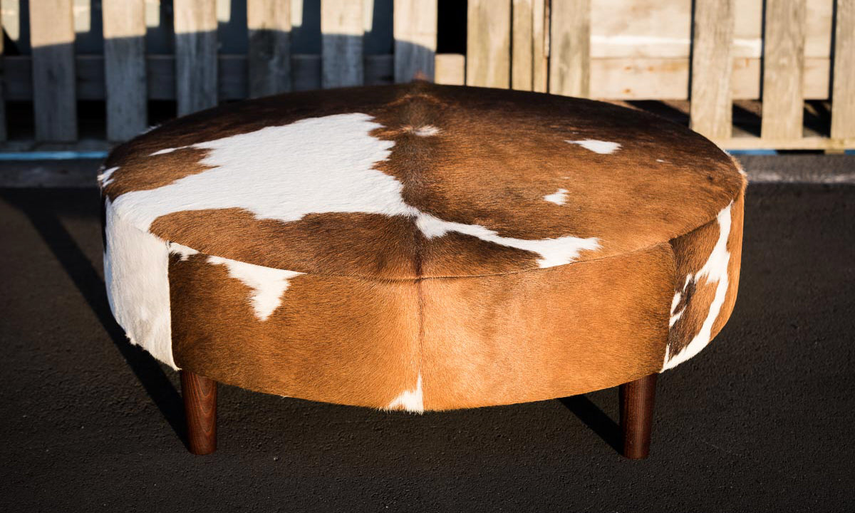 Round cowhide ottomans