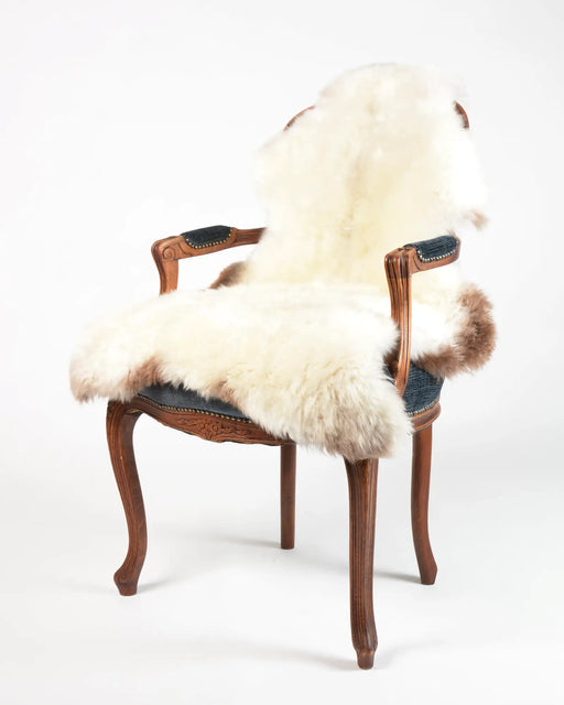 Cream and light brown sheepskin rug