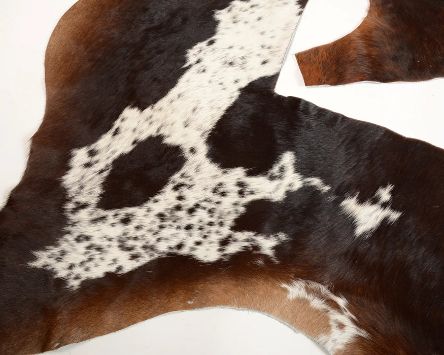 Reddish brown and white cow skin scraps for craft