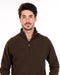 Man wearing a brown half-zip sweater made from possum merino