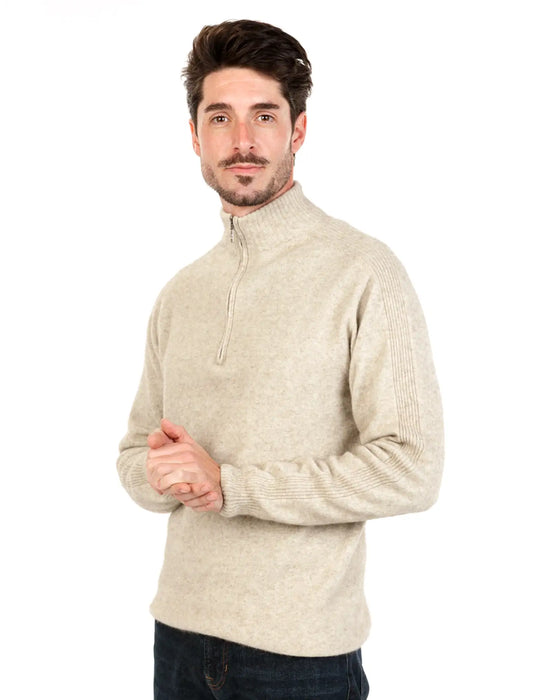 Man wearing a beige half-zip sweater made from possum merino wool