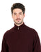 Man wearing a burgundy turtleneck sweater on a white background