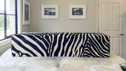 Large bench ottoman covered in zebra print