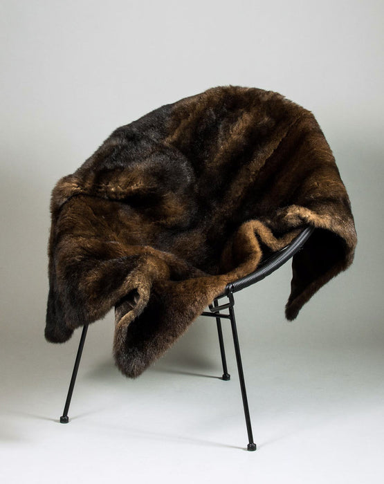 NZ Made Chocolate Brown Possum Fur Throw on a chair